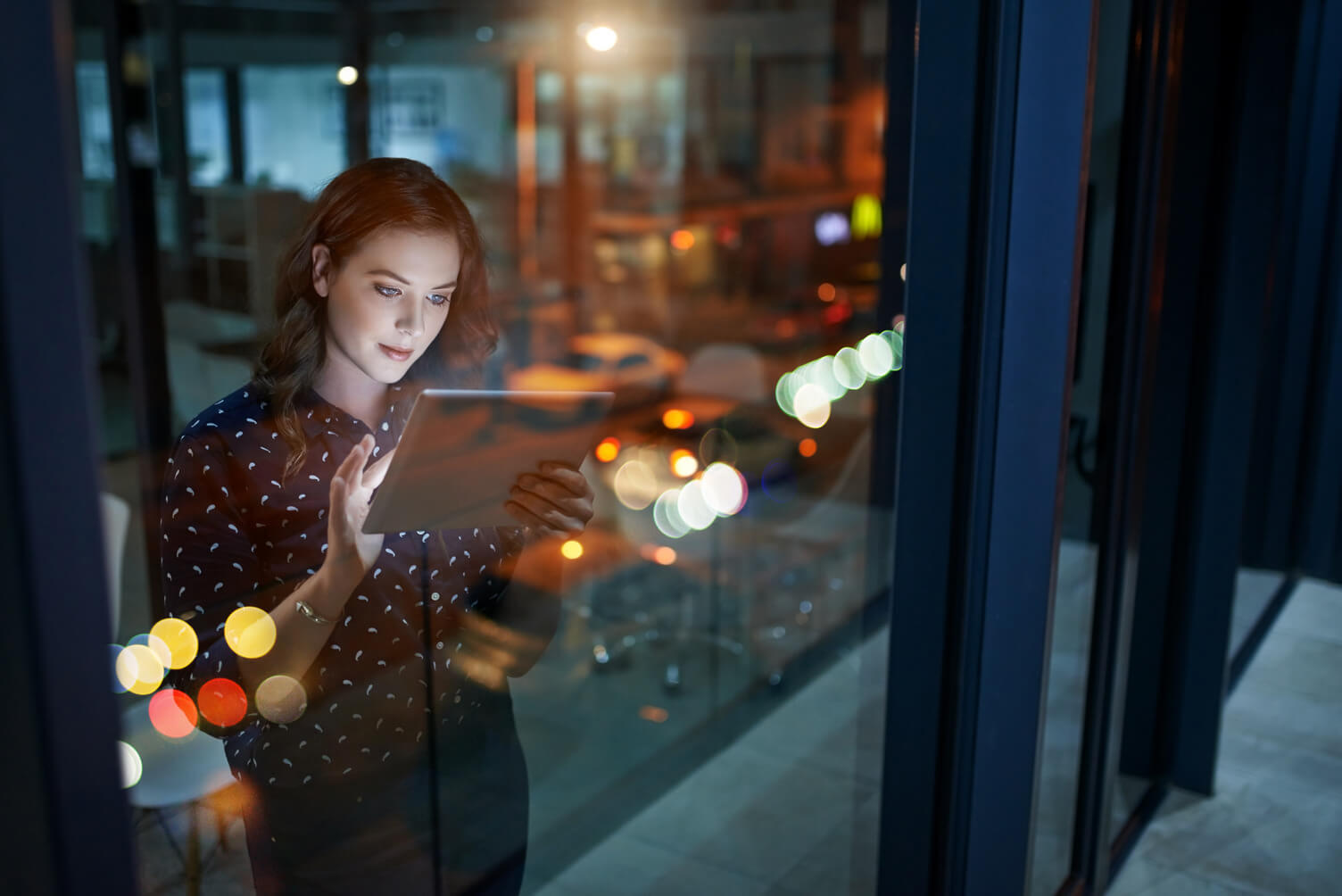 employee looks at computer for on-demand viewing