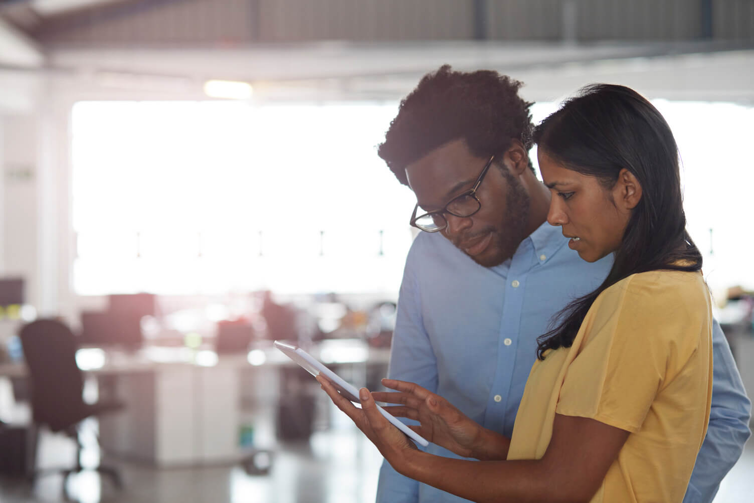 Workers looking at tablet