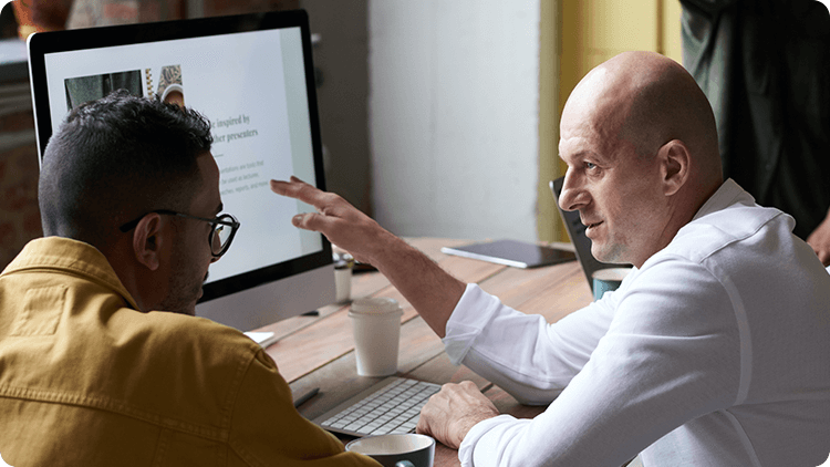 men looking at computer 