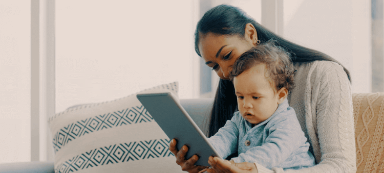 mom and son looking at a tablet