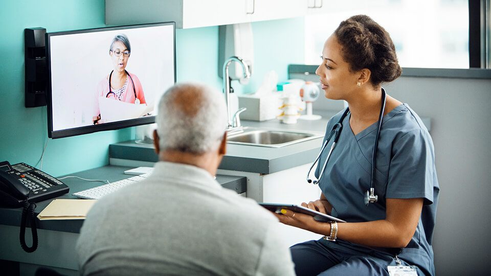 doctor and patient looking at computer