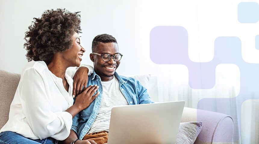 man and woman working on laptop