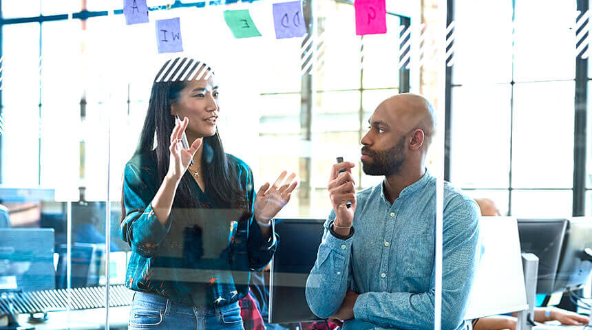 Coworkers meeting with post it notes