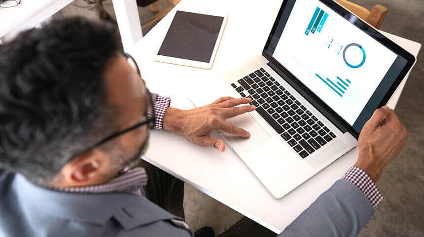 High angle view of businessman using laptop