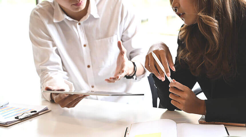 Man and woman meeting with tablet consulting