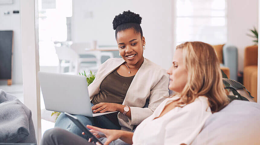 two coworkers discussing on couch