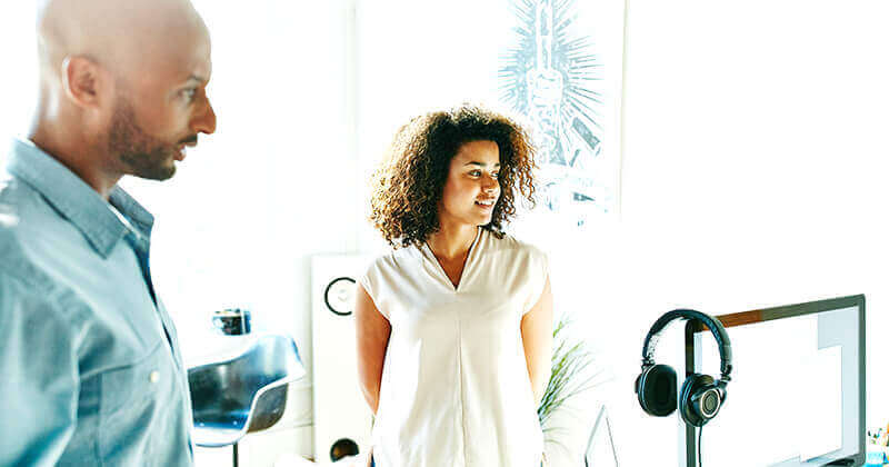 Man and woman listening during meeting