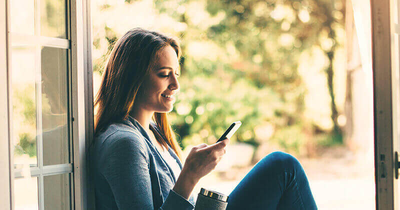 Woman looking at smartphone