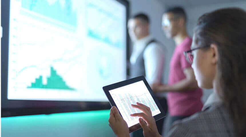 Woman touching graph on tablet