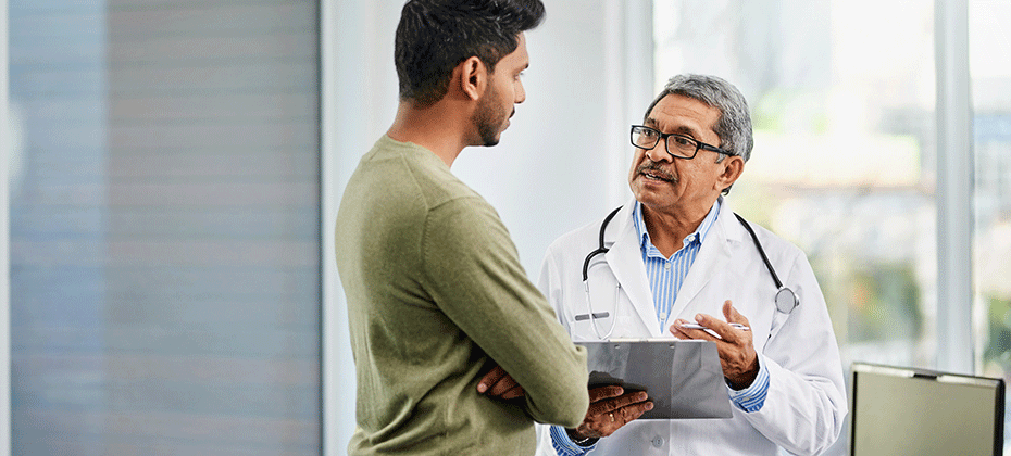 Doctor speaking with a patient in hospital