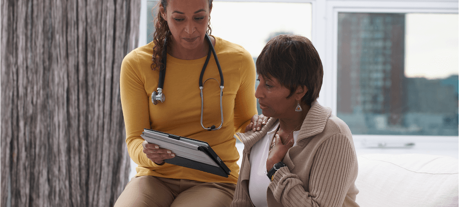 Doctor walking through chart with patient