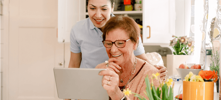 two women looking at computer screen